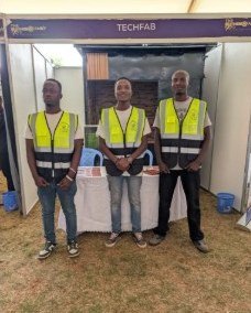 Three TechFab Hub team members at the TechFab exhibition stand